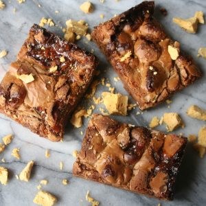 three Honeycomb chocolate brownies with honeycomb crumbled ontop