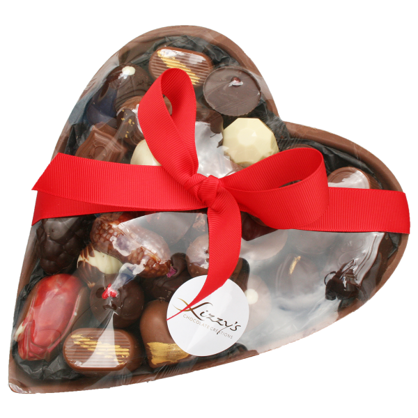 Large heart with assorted chocolates inside wrapped with a bow around